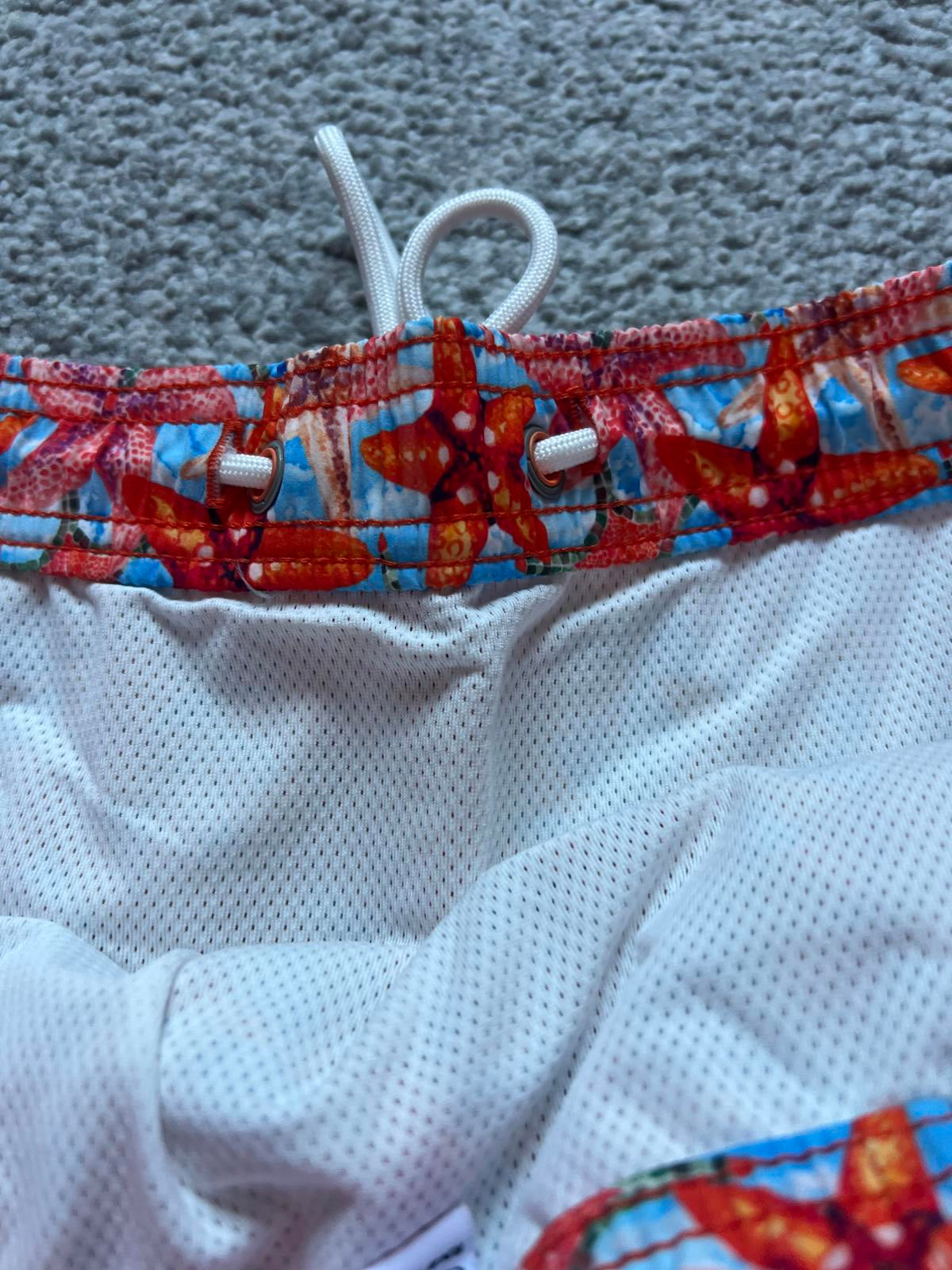 Swims men’s orange swim shorts, size large
