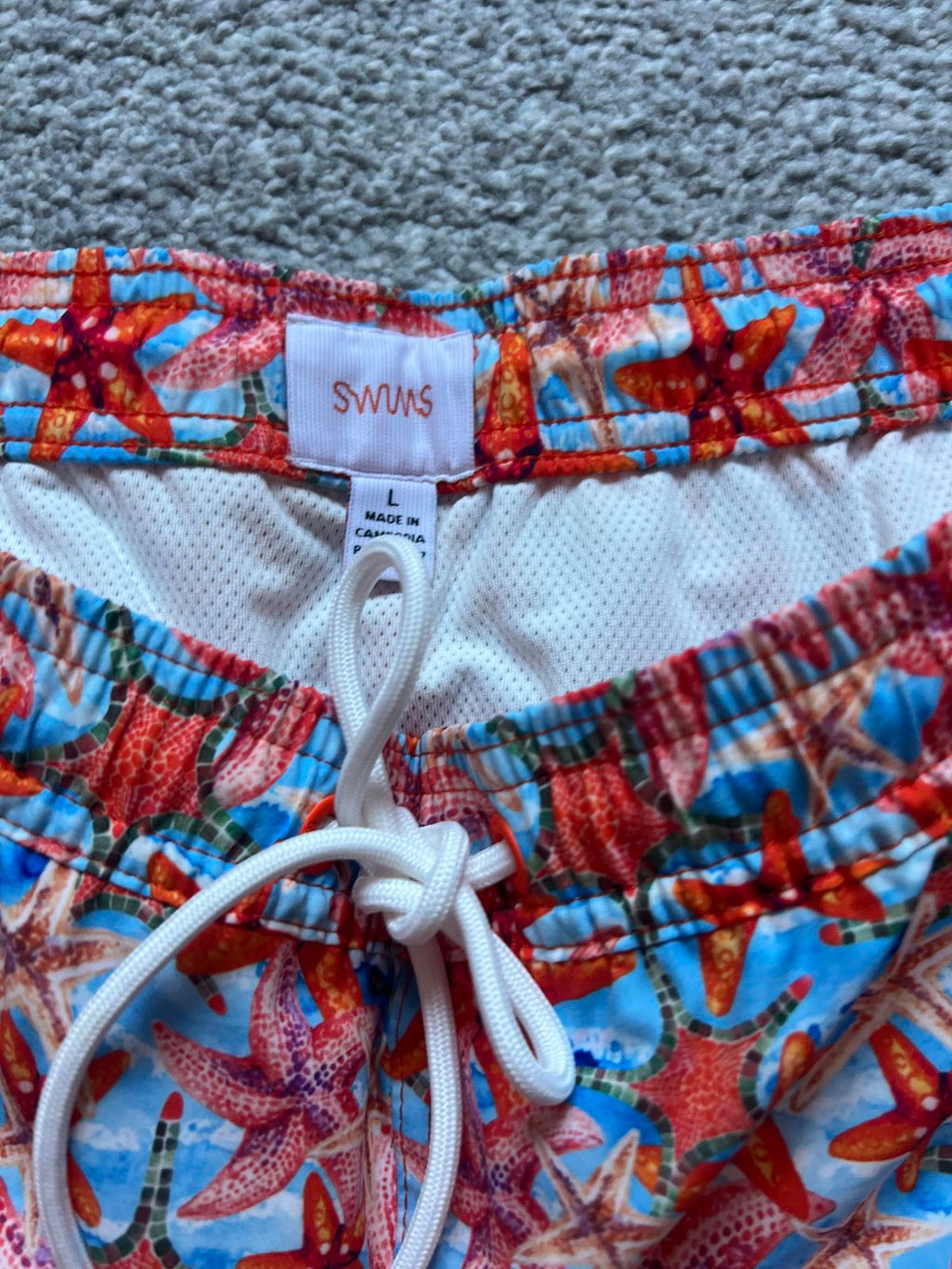 Swims men’s orange swim shorts, size large