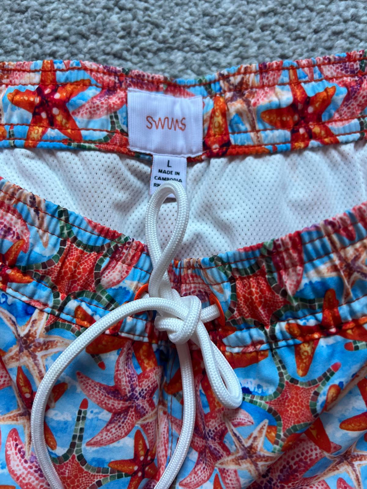 Swims men’s orange swim shorts, size large